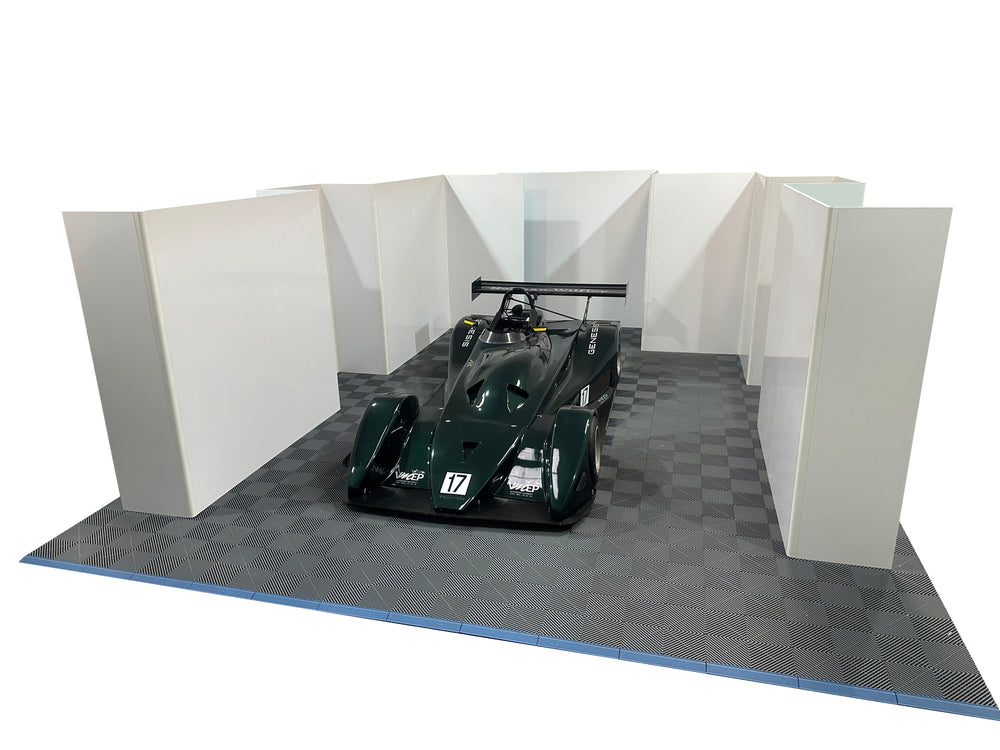 Custom pit walling layout with integrated tool storage and TV screen mounts